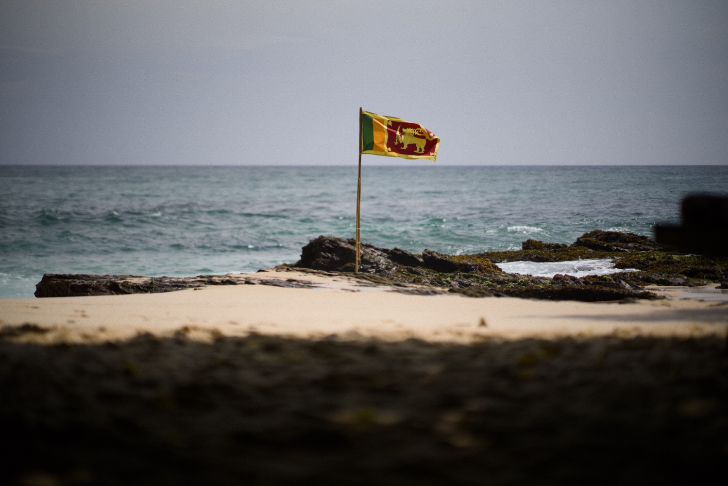 Sri Lanknan flag on the beach.